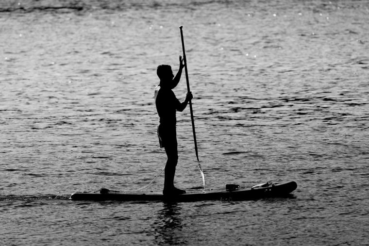 SUP for non-swimmers paddleboarder standing, black and white photo